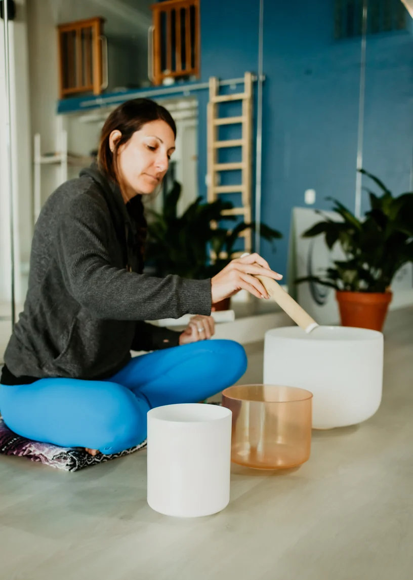 Nazli Takesh playing crystal singing bowls at Union Yoga